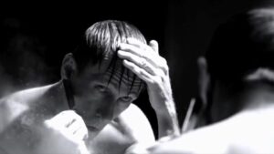 Death's Mirror: Bill Oberst Jr. shaves with a straight razor in the cult horror film DIS by director Adrian Corona